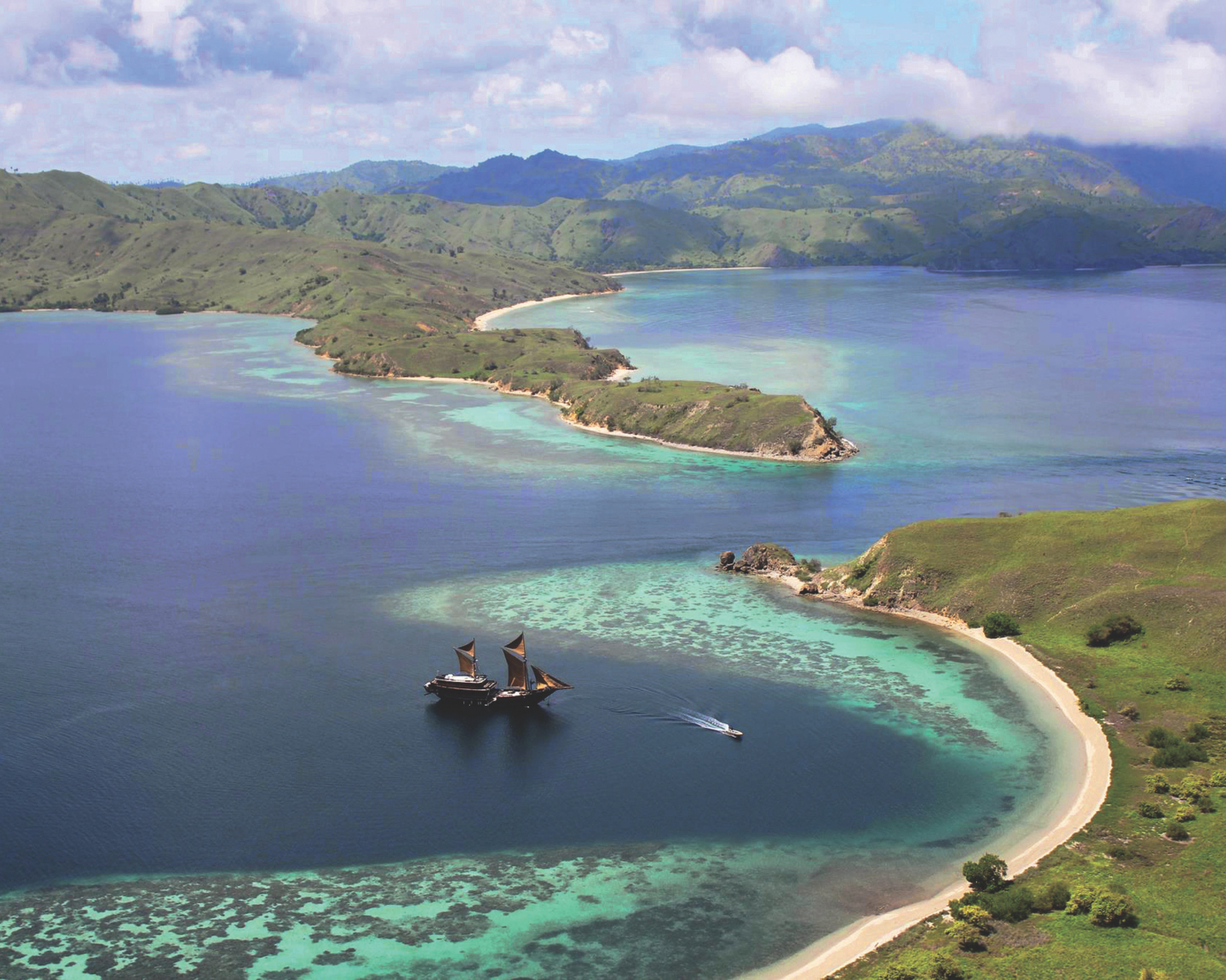 Alila Purnama boat in the ocean.