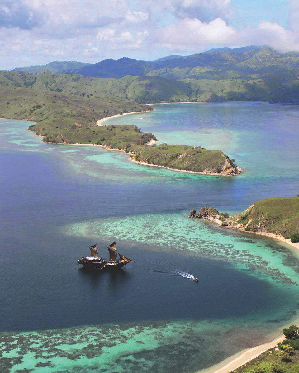 Alila Purnama boat in the ocean.