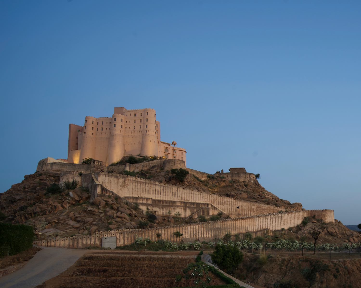 Hotel exterior atop a hill.