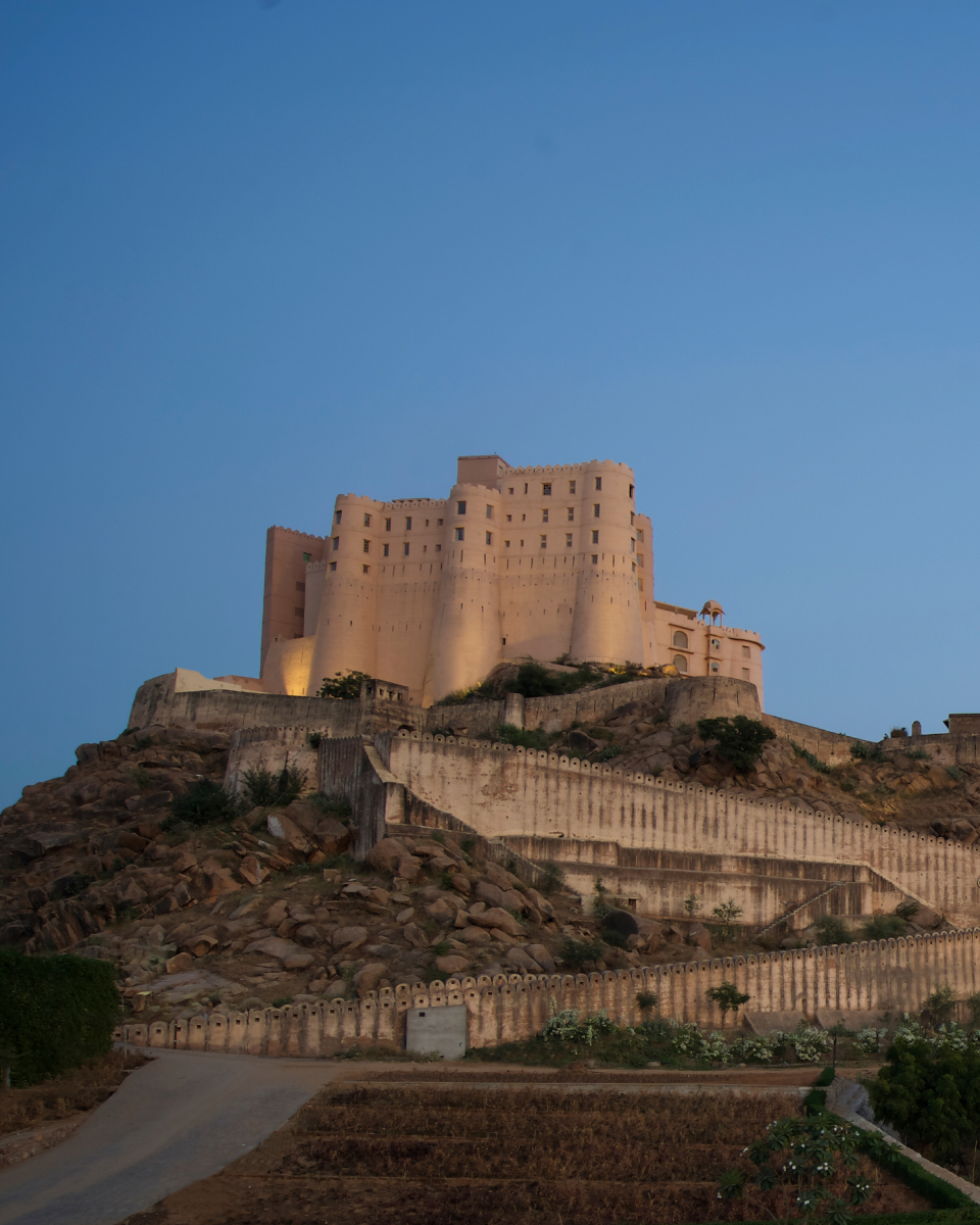 Hotel exterior atop a hill.