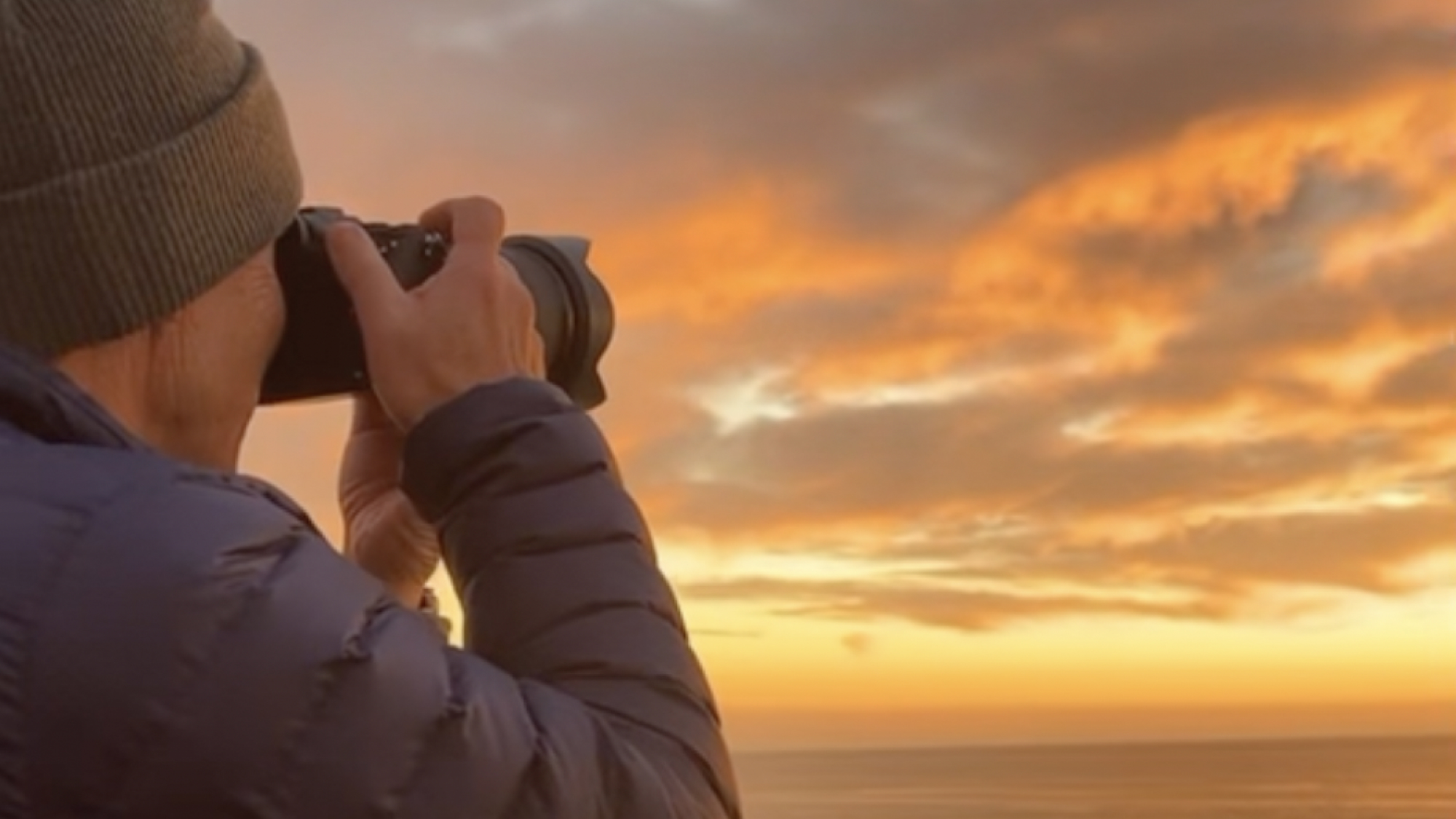 Man taking a photo of the sky