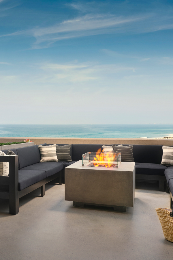view of fire pit on balcony looking out onto ocean
