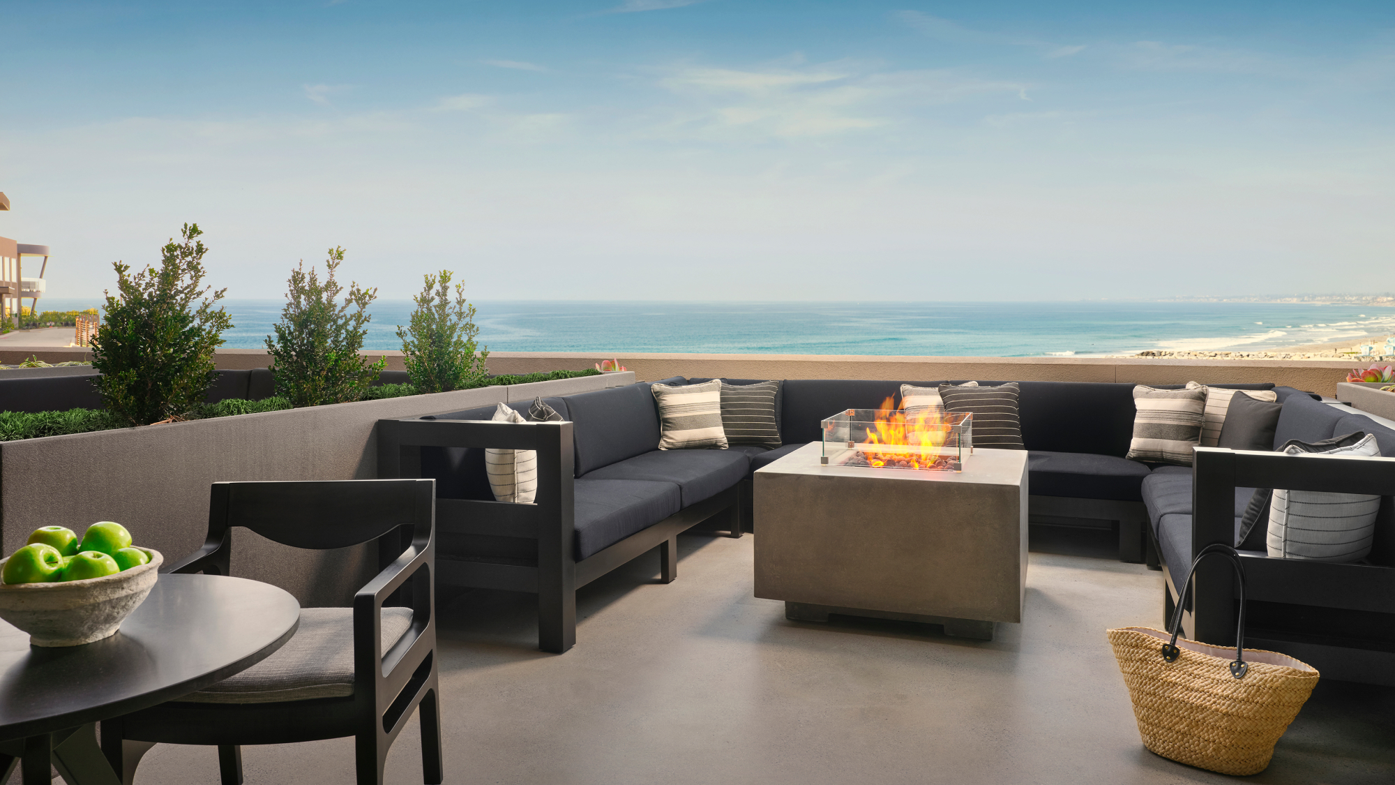 view of fire pit on balcony looking out onto ocean