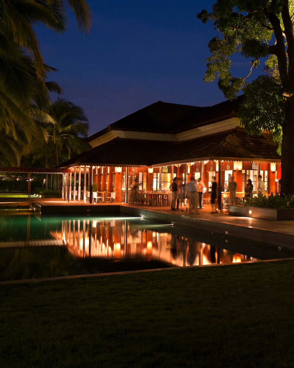exterior restaurant and pool at night