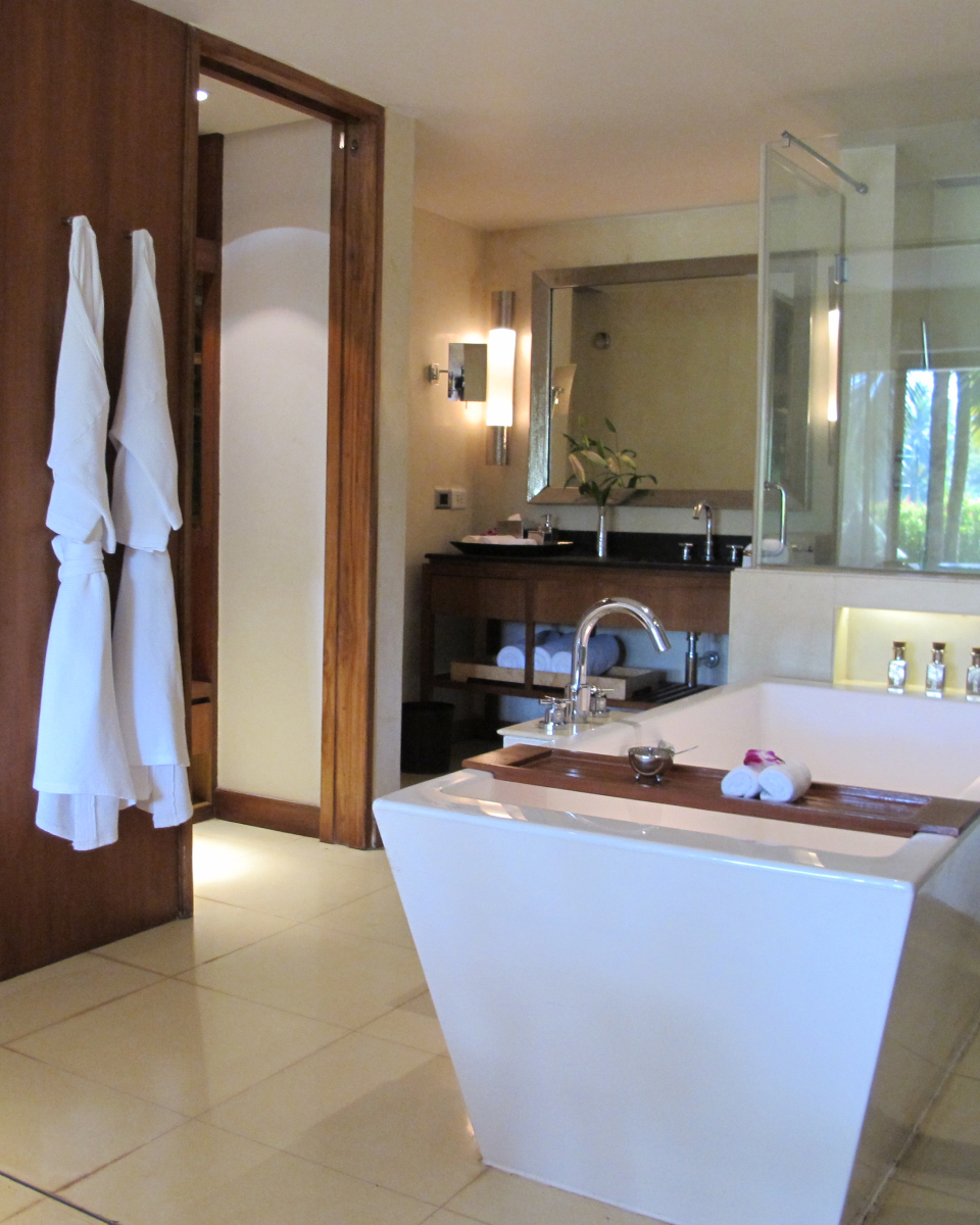 interior hotel room bathroom with hanging robes
