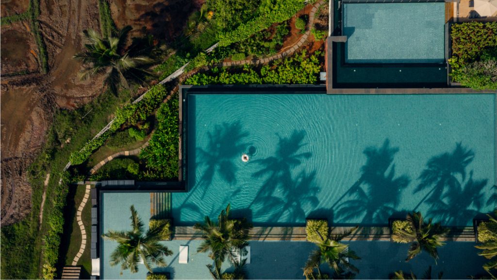 aerial view of hotel property and pool