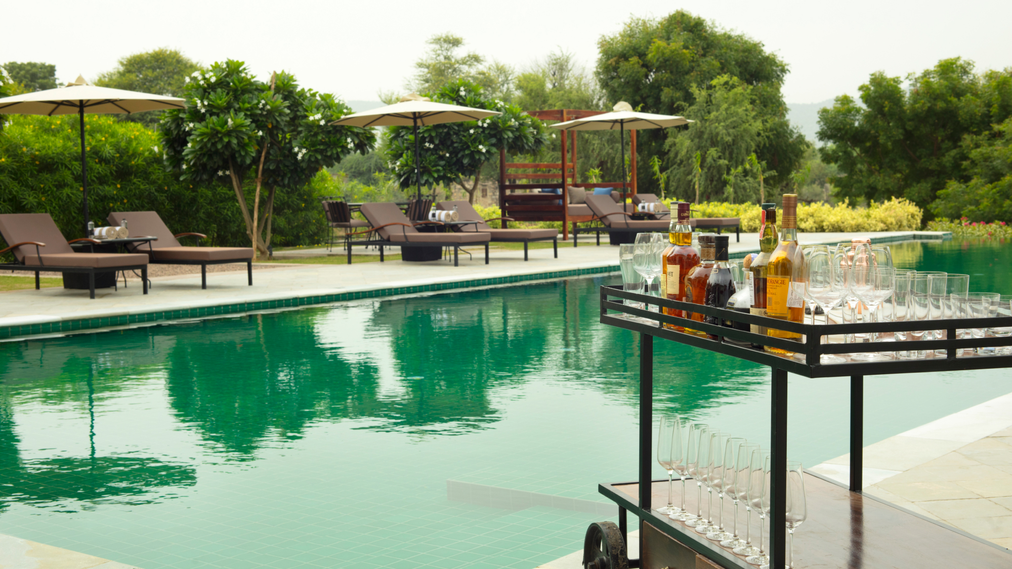 Lounge chairs and umbrellas by the poolside