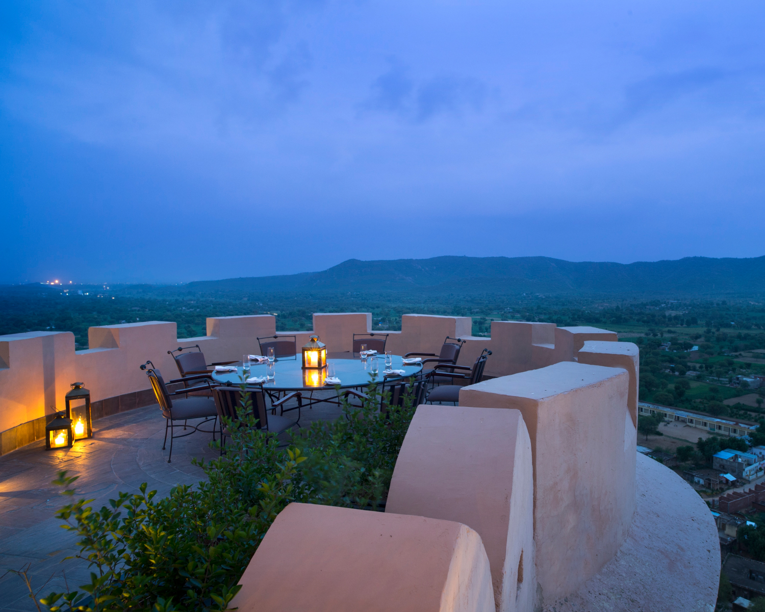 outdoor table with candle in center