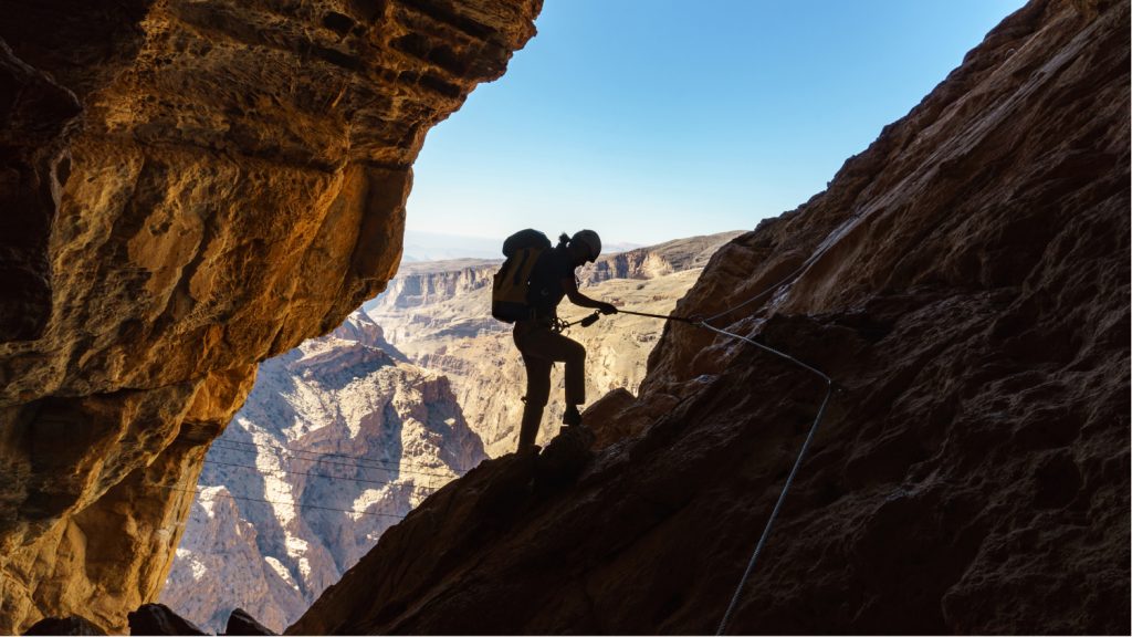 person rock climbing