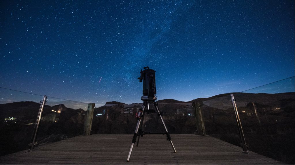 telescope under the stars at night