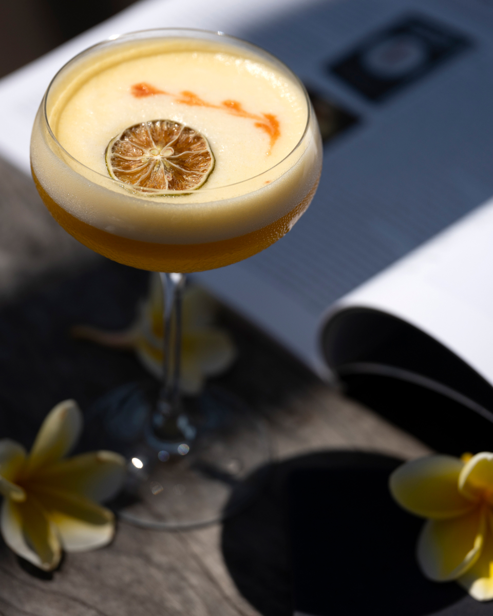Close up shot of a cocktail in a coupe.