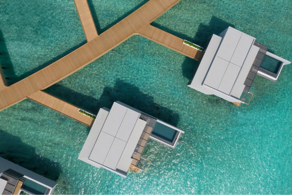 drone view of villas in the crystal blue water