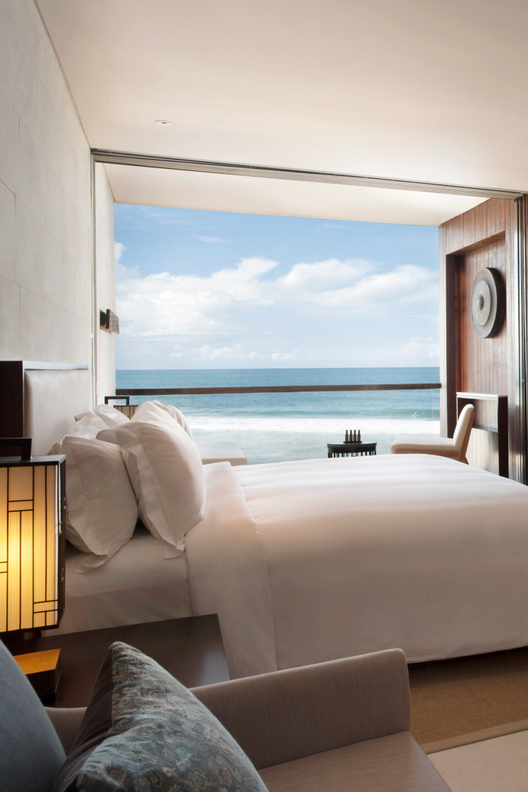 Bed with ocean view suite.