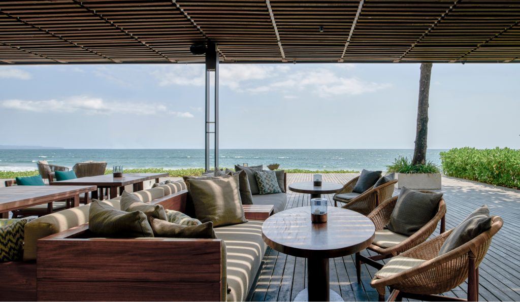 Outdoor couches overlooking the ocean.