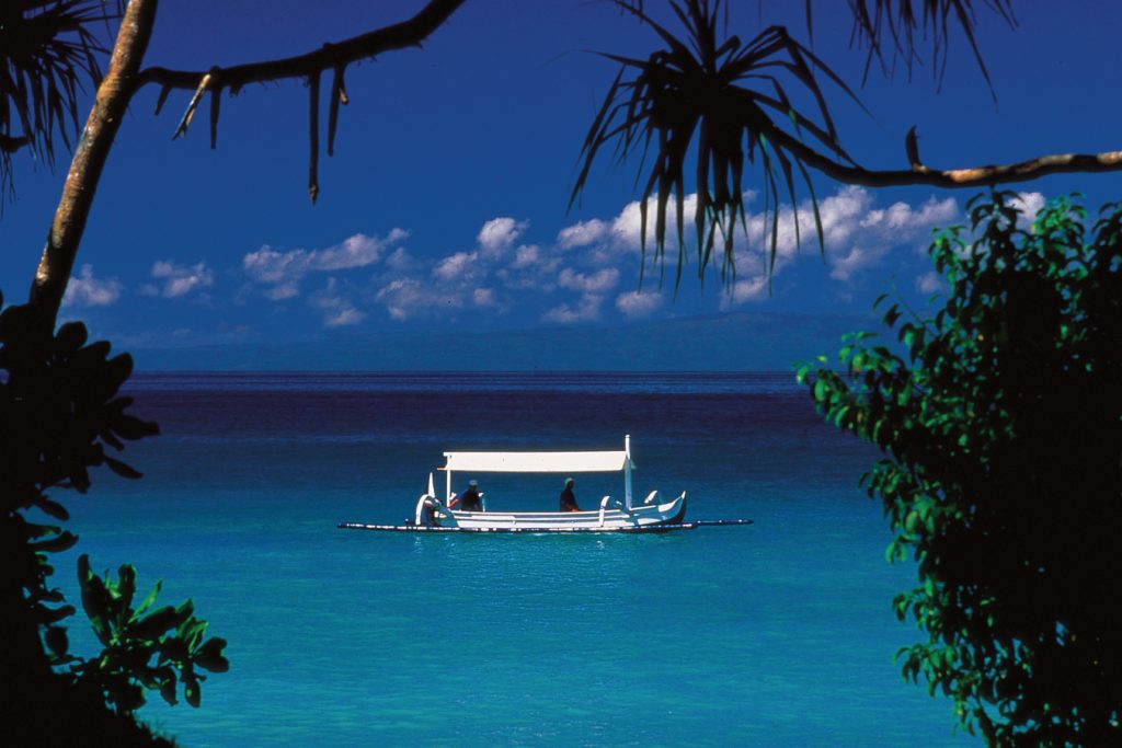 fishing boat in blue water