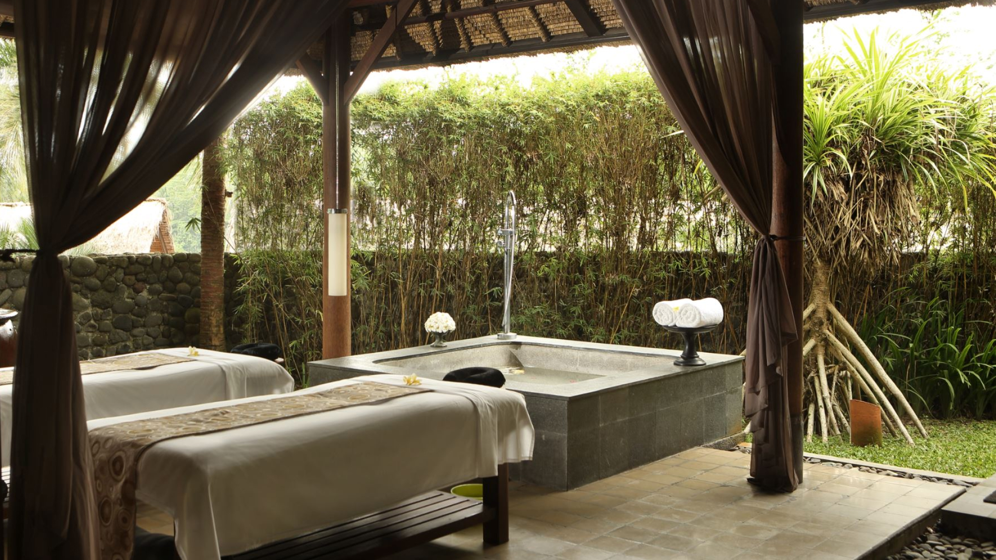 massage beds and pool at the ubud spa