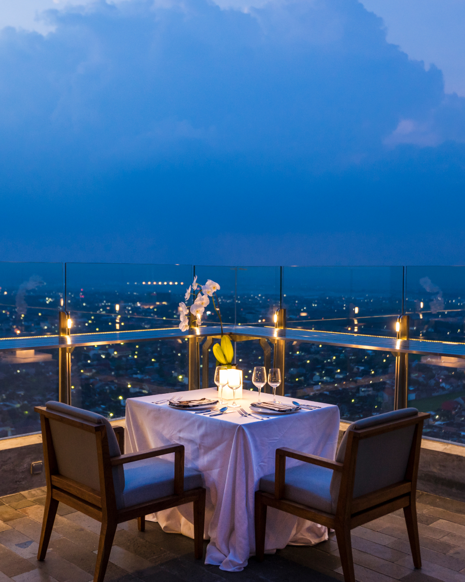 evening dining set up for two overlooking the city