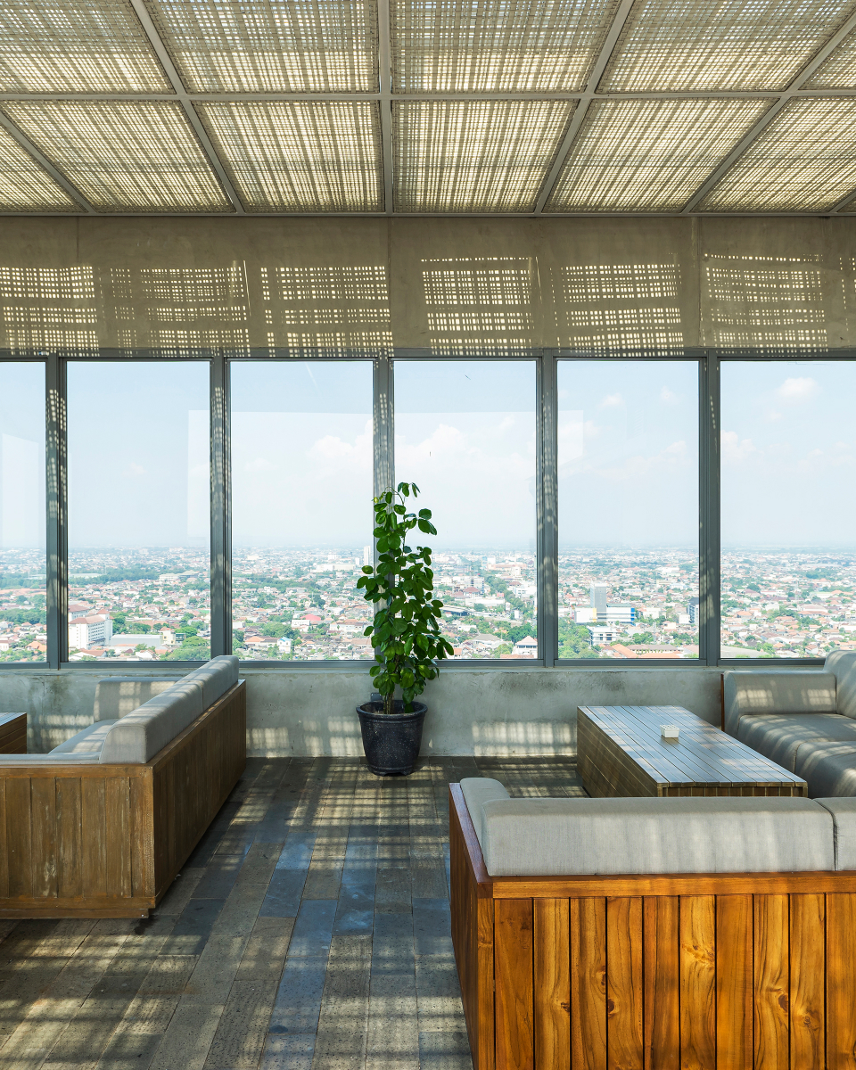 interior living space with large windows and view of city